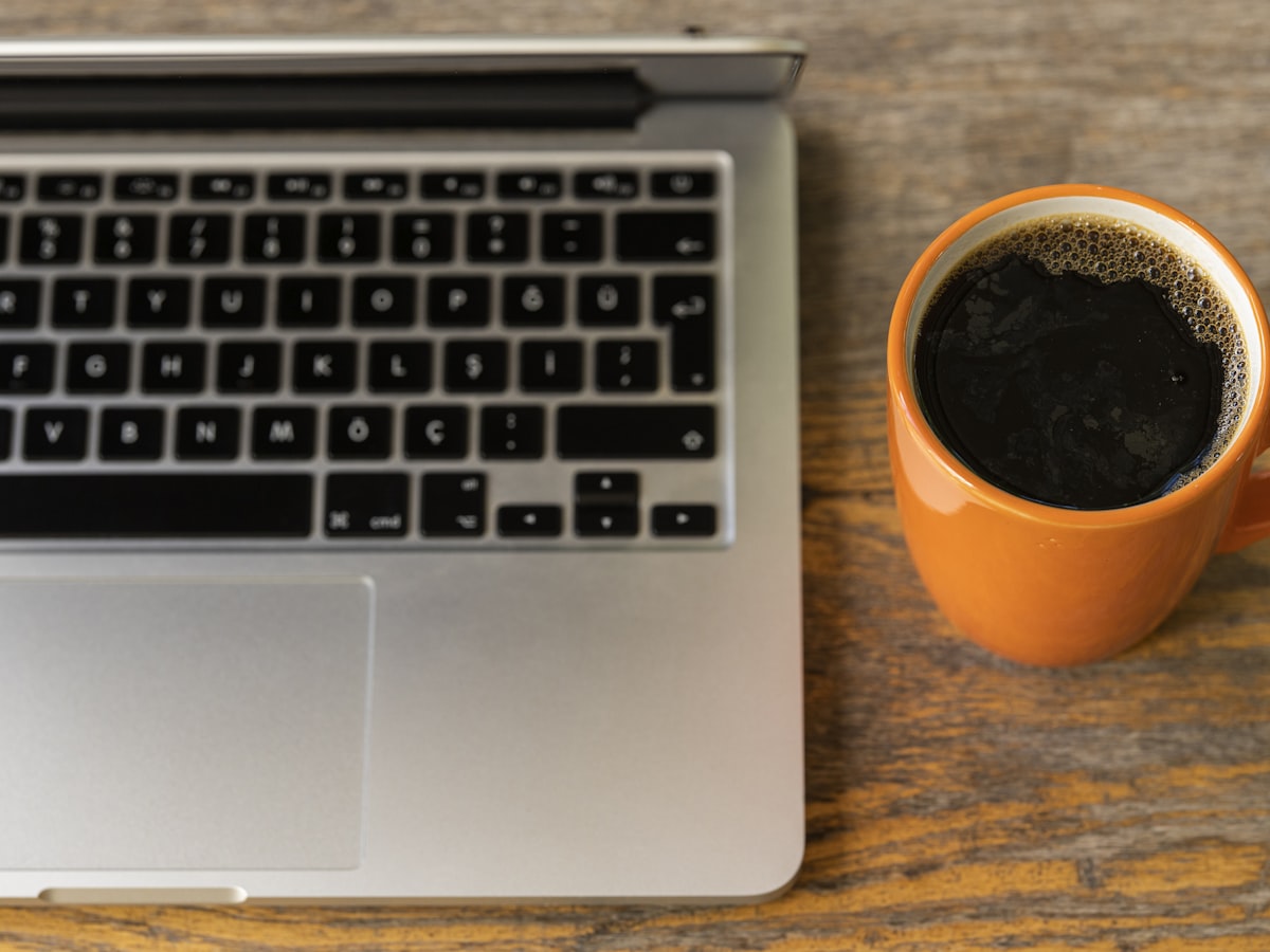 Coffee next to the laptop